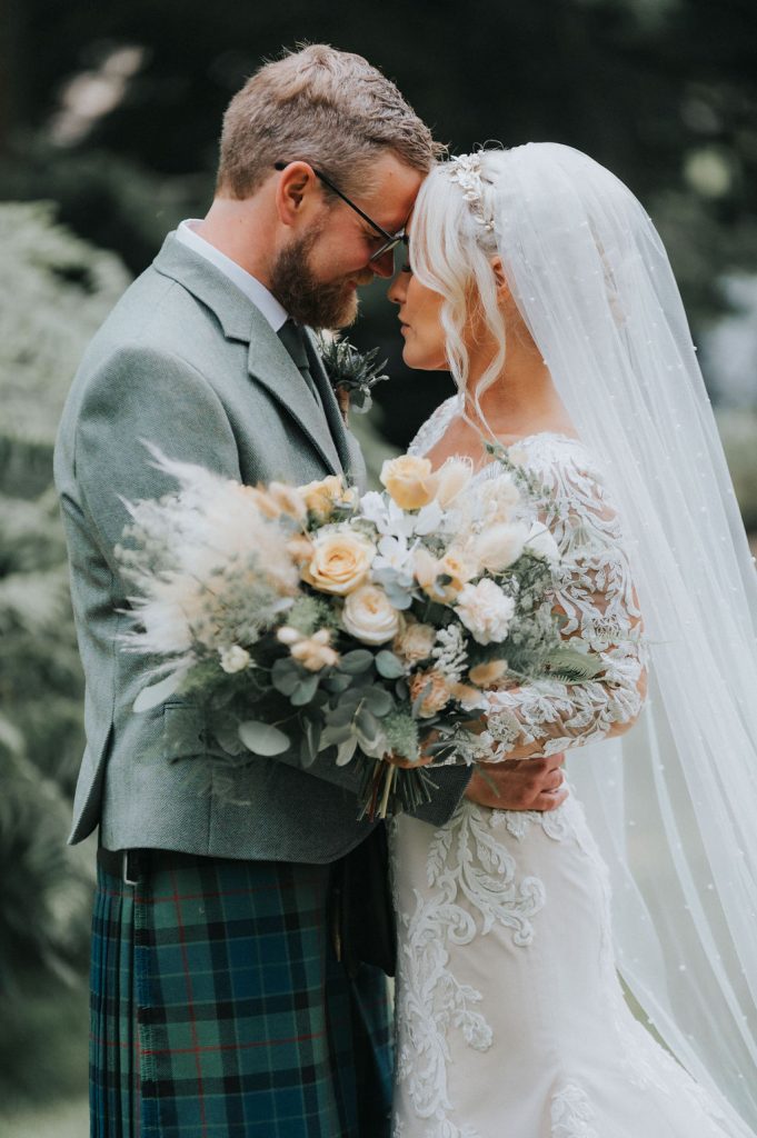 A tender moment between bride & groom. Wedding at Cardney Steading. 