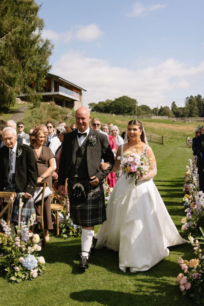 bride + father walking down the aisle