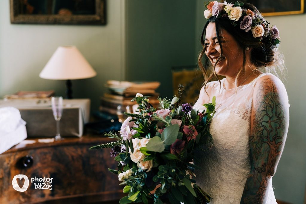Bride wearing a hair circlet and holding a wedding bouquet